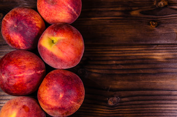 Fresh ripe peaches on wooden table. Top view