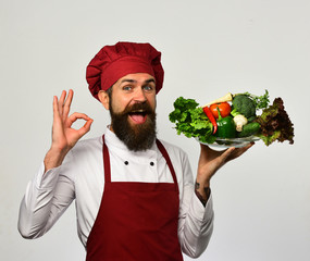 Cooking and vegetarian diet concept. Cook with proud face