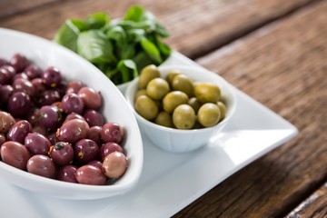 Marinated olives with herbs in bowl