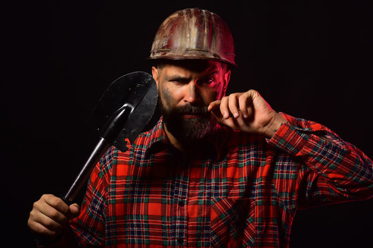 Construction and work concept. Builder or miner with thick beard