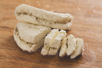 Homemade dairy, soft cheese, milk product on wood