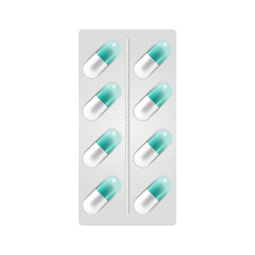 Capsule-shaped pills in blister pack isolated on the white background. Medicine and drugs.