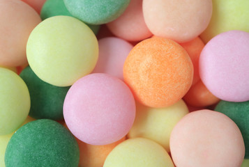 Heap of Beautiful Colored Sugar Coated Candies, Top View for Background, Banner, Texture 