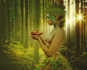 Beauty nymph with snail in his hands with natural backgrounds