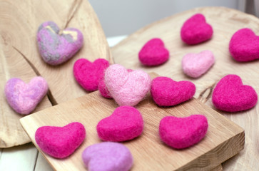 Fototapeta na wymiar Pink little hearts on wooden surface