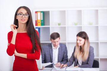 Confident businesswoman sitting at a business presentation