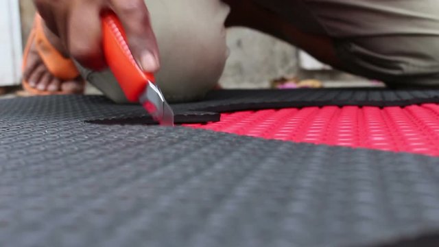 hands cutting EVA foam