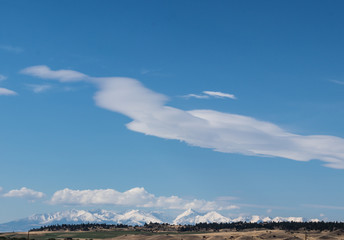 Snowcapped Yellowstone Mountain Landscape with beautiful clouds over snowy mountain peaks 