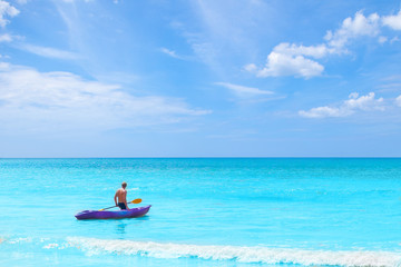 a man pulling kayak in the sea on blue sky vacation holiday summer time concepts