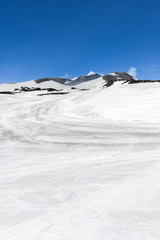 Snow on mount etna with blue sky