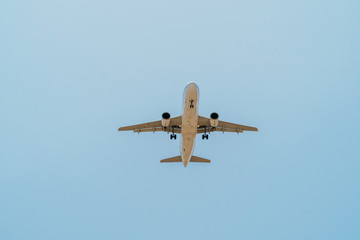 Passenger Airplane Flying On Clear Blue Sky