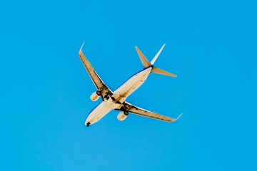 Passenger Airplane Flying On Clear Blue Sky