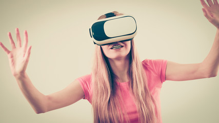 Girl wearing virtual reality goggles.