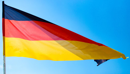 Flag of Germany against the blue sky