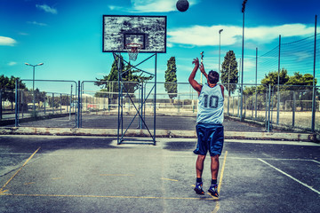 Fototapeta na wymiar Jump shot in a basketball court