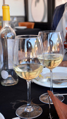 Celebration with two glasses of white wine.