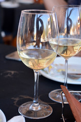 Celebration with two glasses of white wine.
