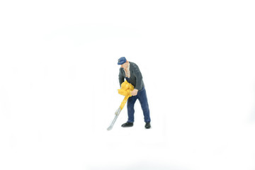 Miniature people Track workers concept on white background with a space for text.