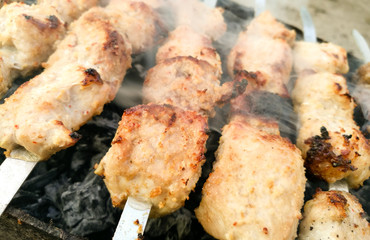 Shish kebab on metal sticks roasted on the grill