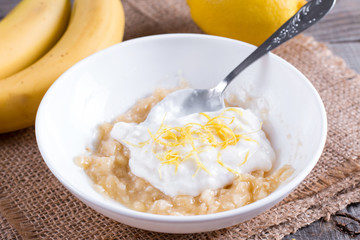 Banana puree with yogurt and lemon zest in a white bowl