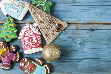 Christmas gingerbread cookies on old wooden background