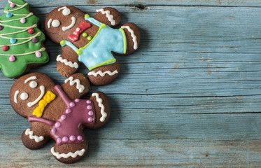 Christmas gingerbread cookies on old wooden background