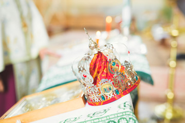 Golden crowns lying on the table in church