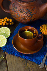 Sea buckthorn tea with lime, ready to drink.