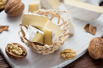 Obraz na płótnie Canvas walnut with brie cheese in the basket