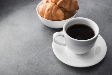 delicious croissant with a cup of coffee