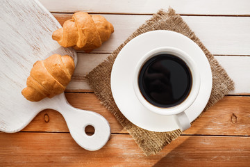 aroma cup of coffee with sweet croissant