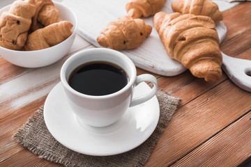 aroma cup of coffee with sweet croissant
