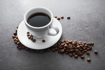 white ceramic cup with black coffee