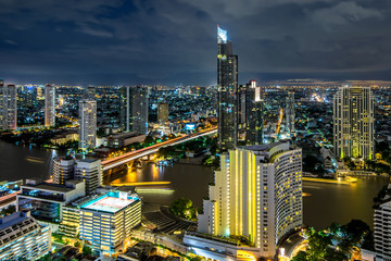 Fototapeta na wymiar Bangkok city - Beautiful sunset curve Chao Phraya River long exposure light Cityscape urban of Bangkok city at night , panorama landscape Thailand