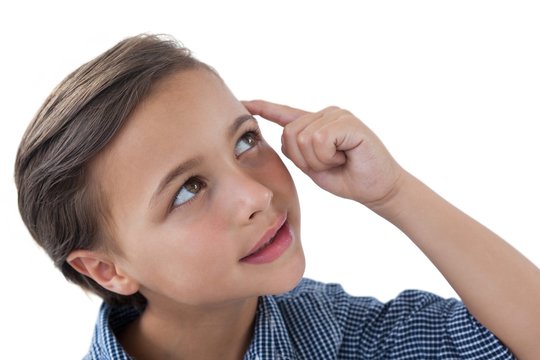 Boy standing against white background