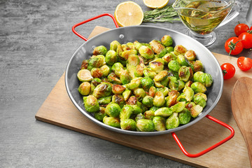 Frying pan with roasted brussel sprouts on table