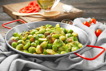 Frying pan with roasted brussel sprouts on table