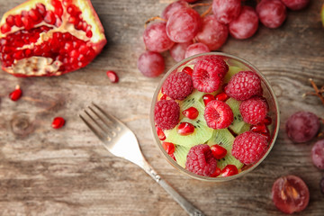 Delicious fruit salad in jar on table