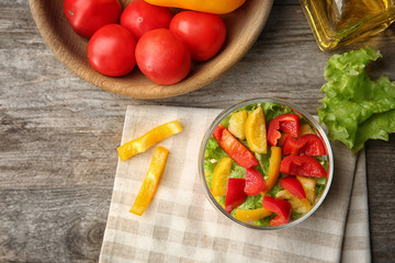 Delicious vegetable salad in jar on table