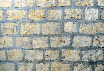 Wall of stone blocks, background, texture