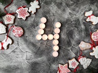 Date in calendar. December day. Christmas is coming. Advent. New Year and Christmas background. Number from candle light. Homemade Christmas cookies. 31 of December
