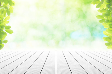 Empty wooden table with party in garden background blurred.