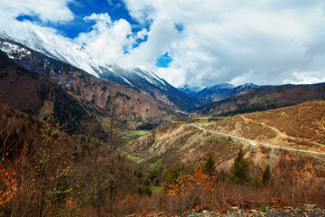 Panoramic view on snow winter spring mountains and cloud sky. Caucasus Mountains. Svaneti region of Georgia.