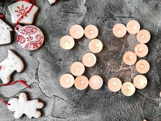 Date in calendar. December day. Christmas is coming. Advent. New Year and Christmas background. Number from candle light. Homemade Christmas cookies. 31 of December