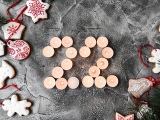 Date in calendar. December day. Christmas is coming. Advent. New Year and Christmas background. Number from candle light. Homemade Christmas cookies. 31 of December