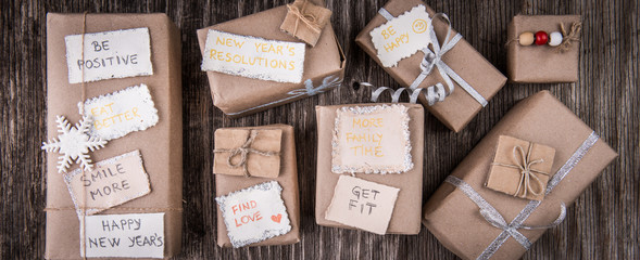 Closeup of gift boxes and new year resolution notes
