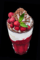 tasty cream dessert with raspberry