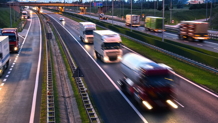 Fototapeta na wymiar Trucks on four lane controlled-access highway in Poland