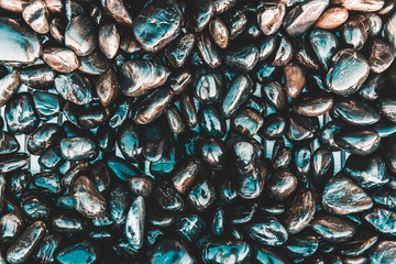 Background texture of wet smooth pebbles