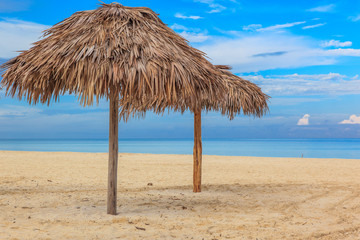 Beach in the Caribbean and umbrellas.